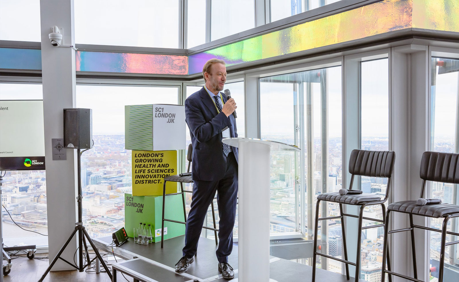 Professor Graham Lord speaks on a stage at the SC1 event