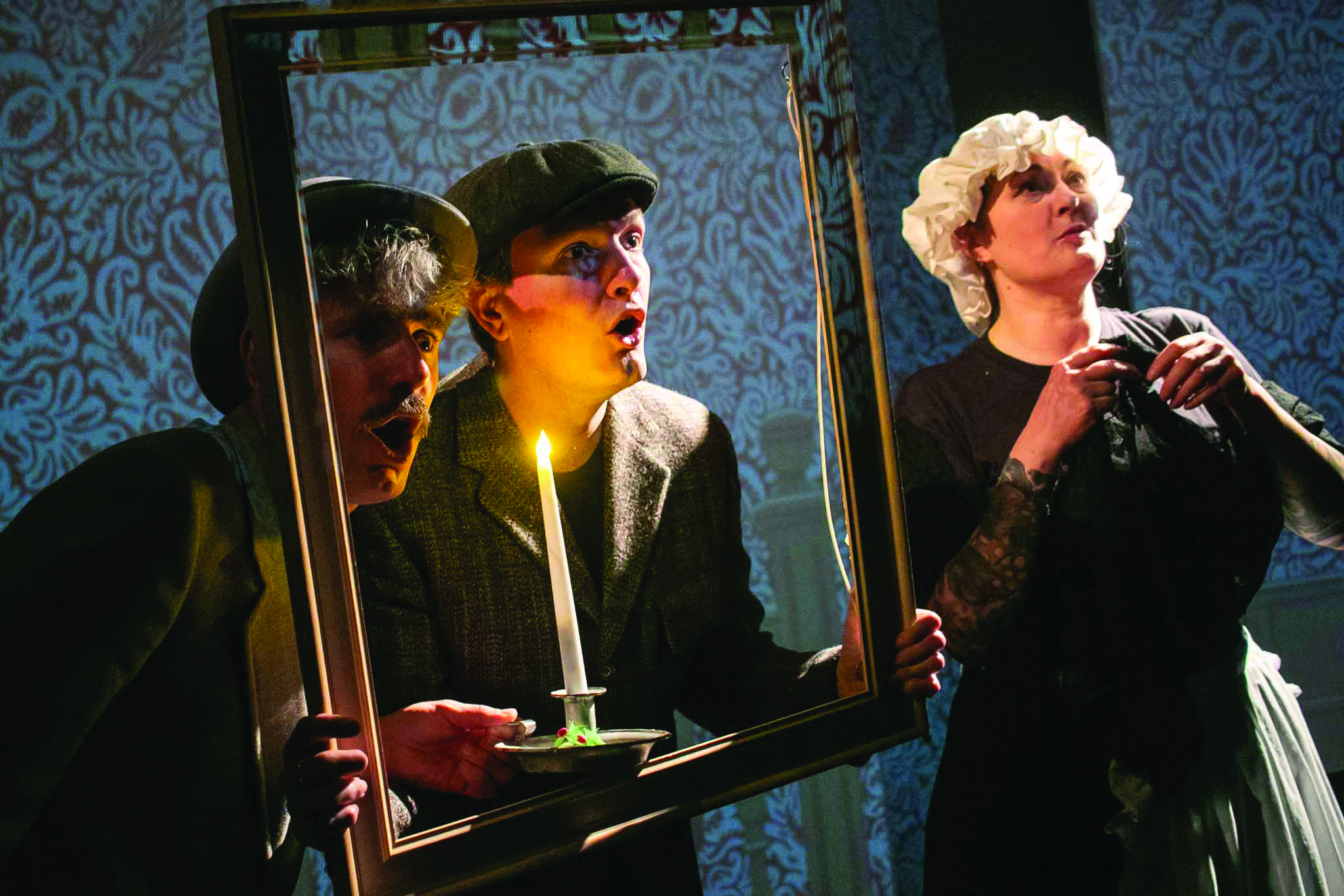 A group of three actors dressed in nineteenth century costumes performing a play at South London Theatre