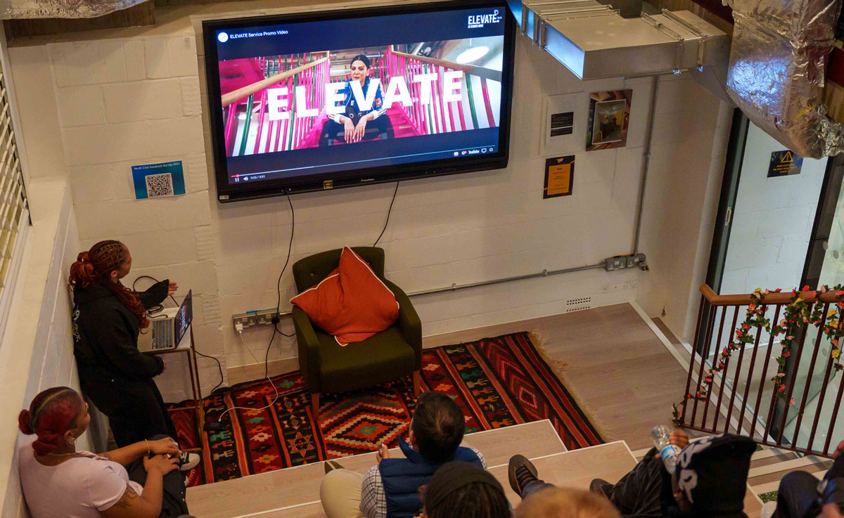A screen showing a film about Lambeth's ELEVATE programme