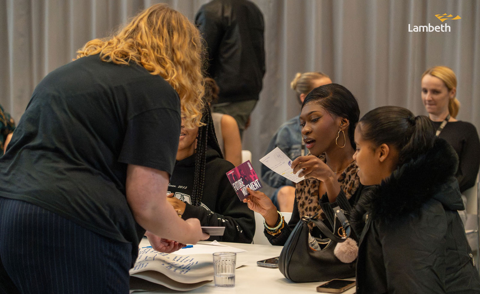 A group of people seated at a table during a workshop