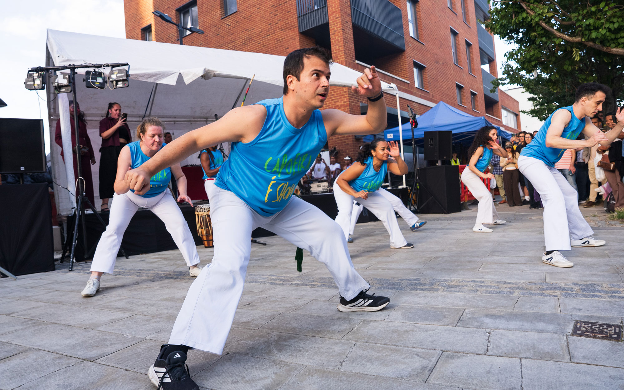 A capoeira group performs on stage for visitors during the Day of Portugal celebration in Little Portugal.