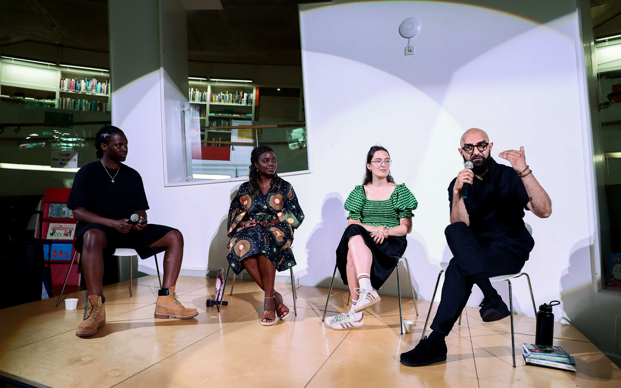 Panellists discussing their work with students.