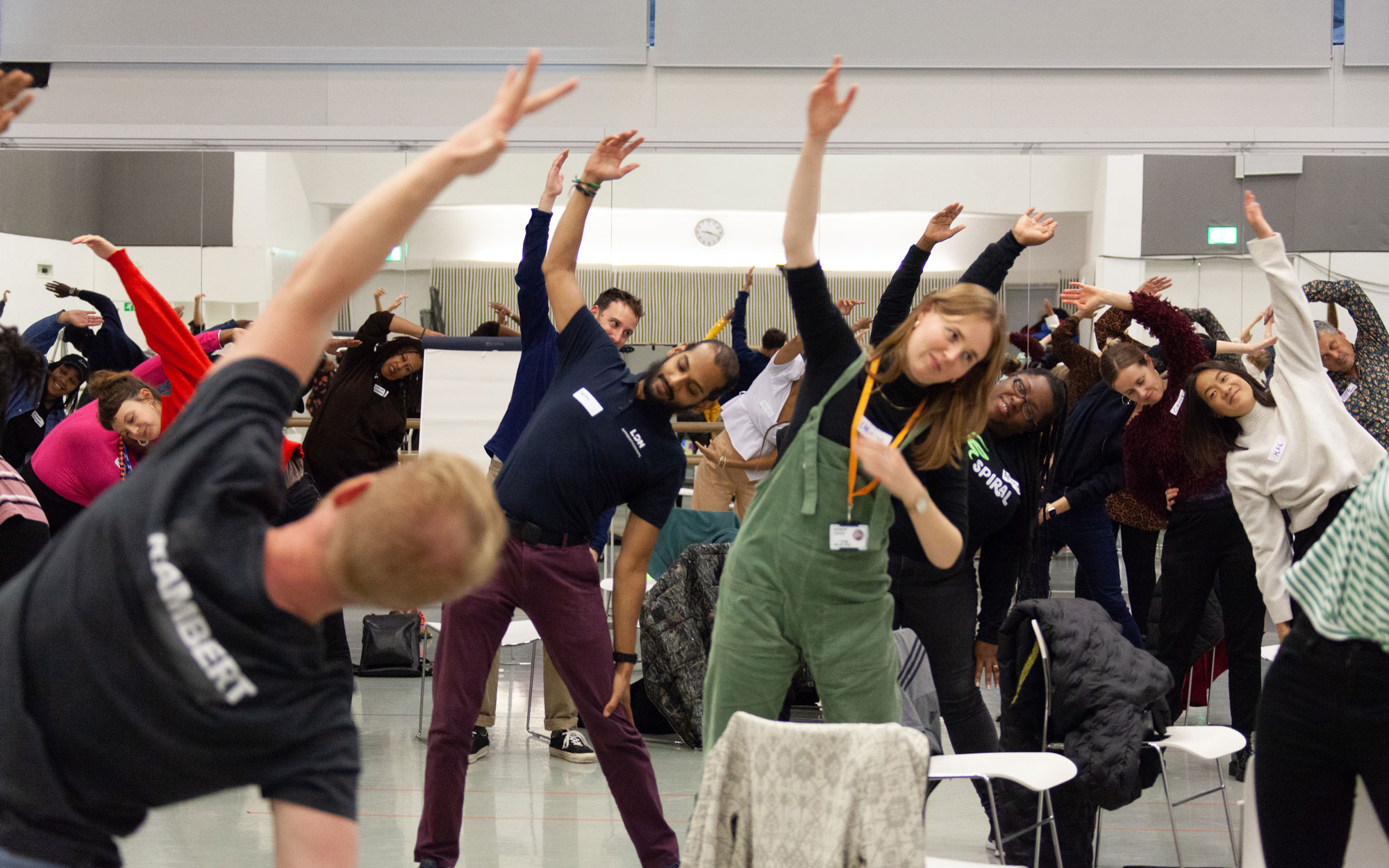 future movement Participants take part in a group stretching exercise during a Rambert-led movement workshop.