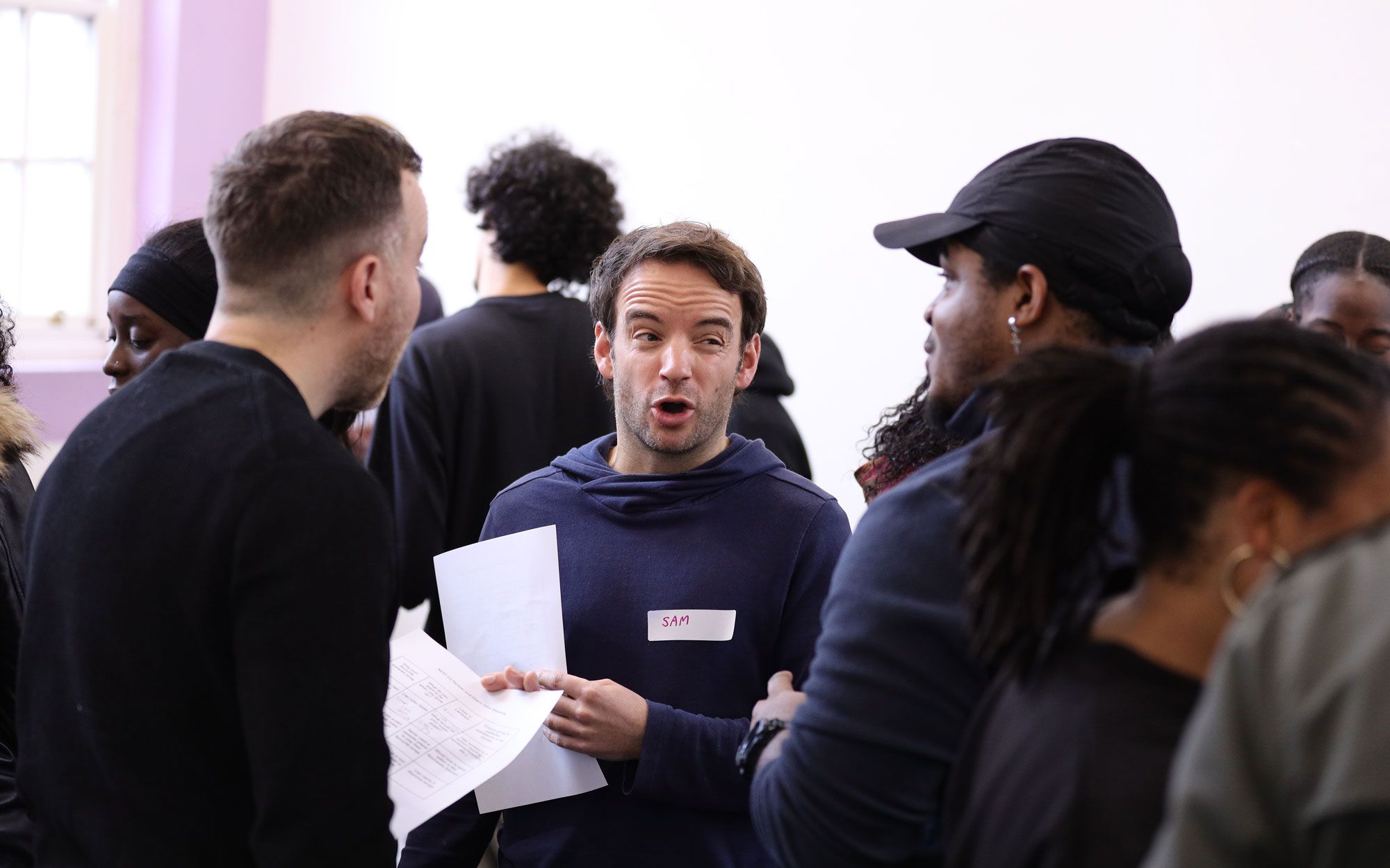People take part in a group discussion during a creative bootcamp.