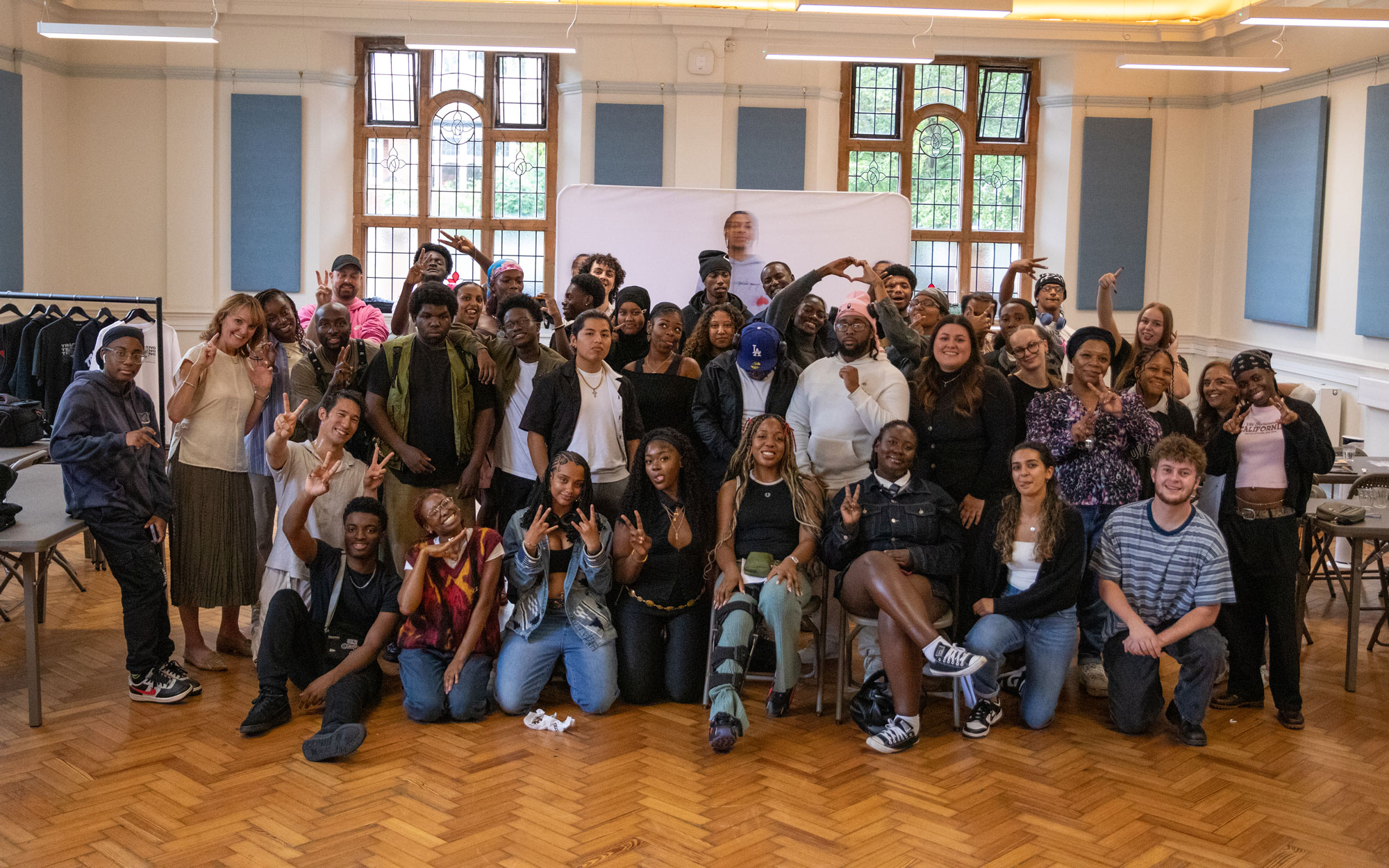 Young people, organisers and supporters gather for a group photo at a Trash Gxng bootcamp.