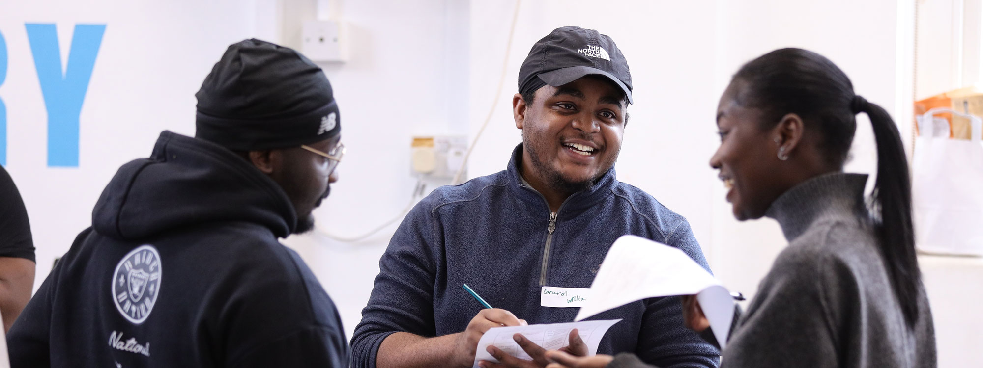 Young people smiling during a workshop